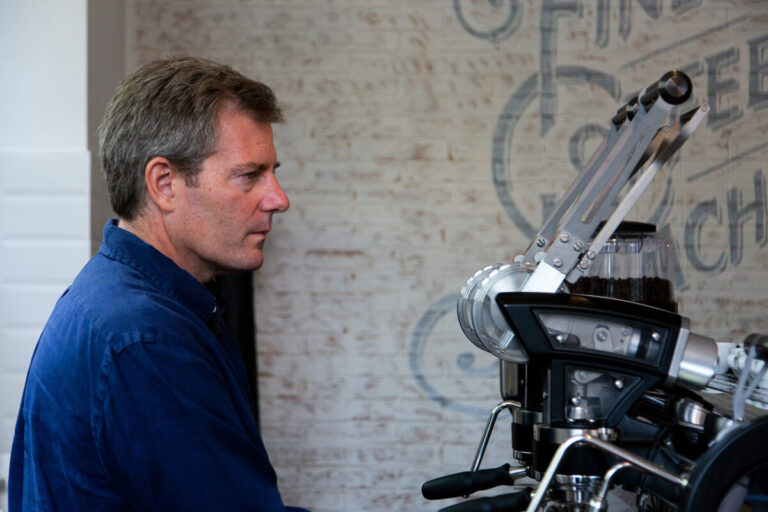 Barista pulling an espresso shot using a La Marzocco machine.