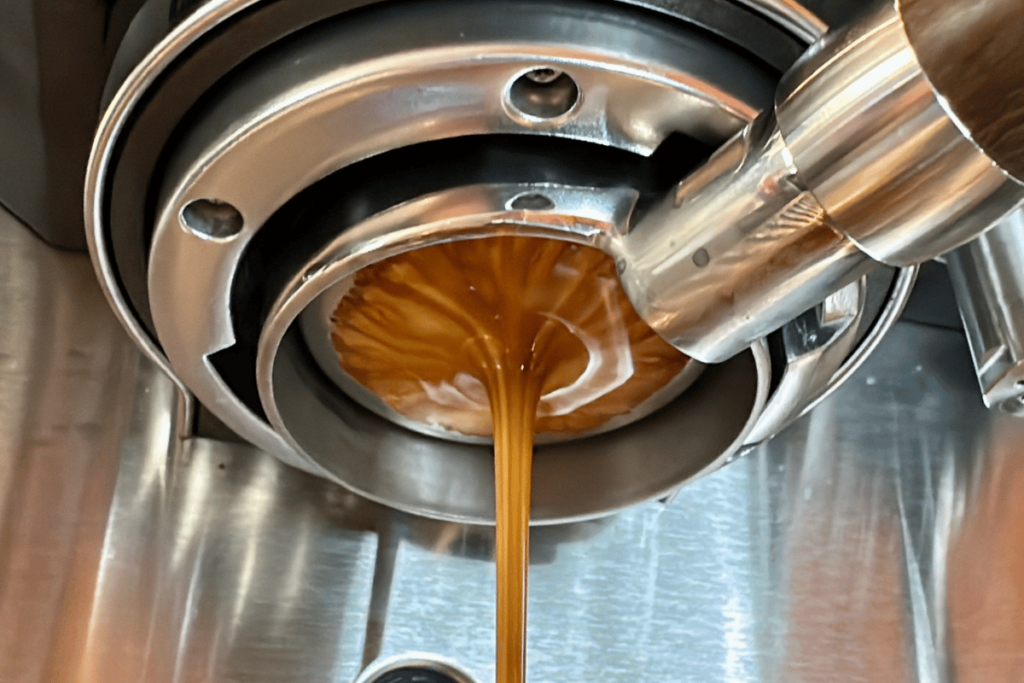 Bottomless portafilter showing signs of channeling from light roast African coffee