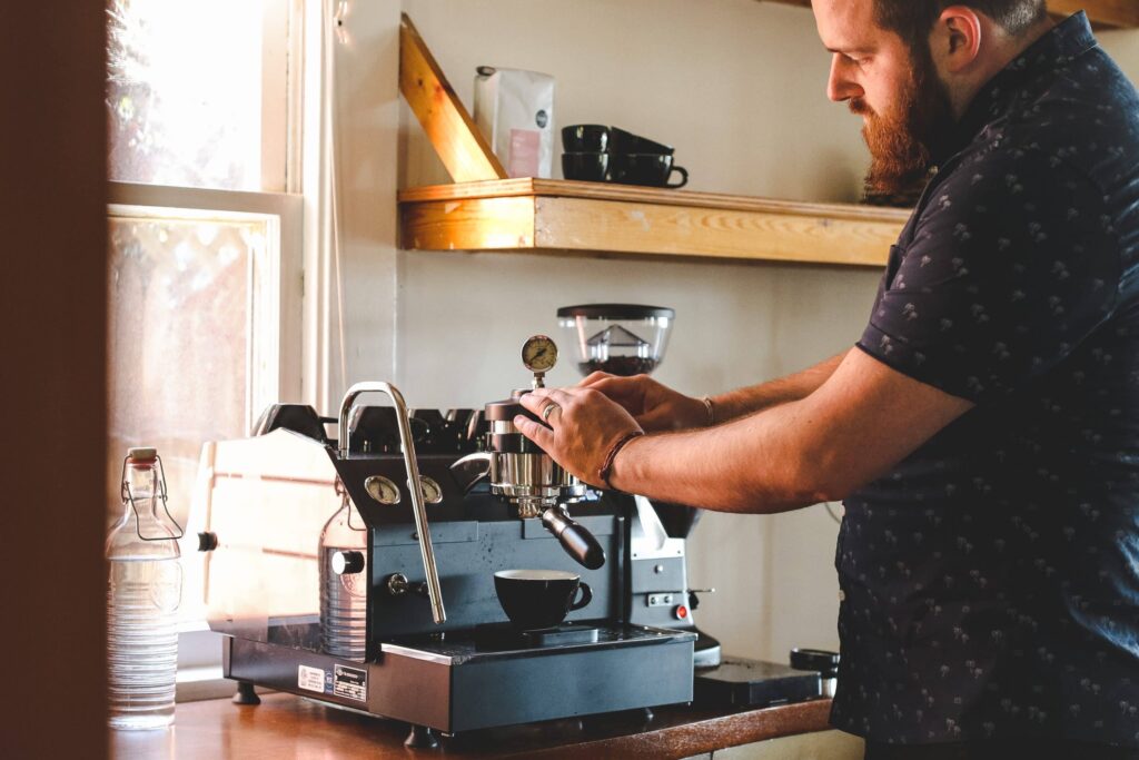 Barista using a pressure profiling machine (e.g., Slayer, Decent, La Marzocco GS3)