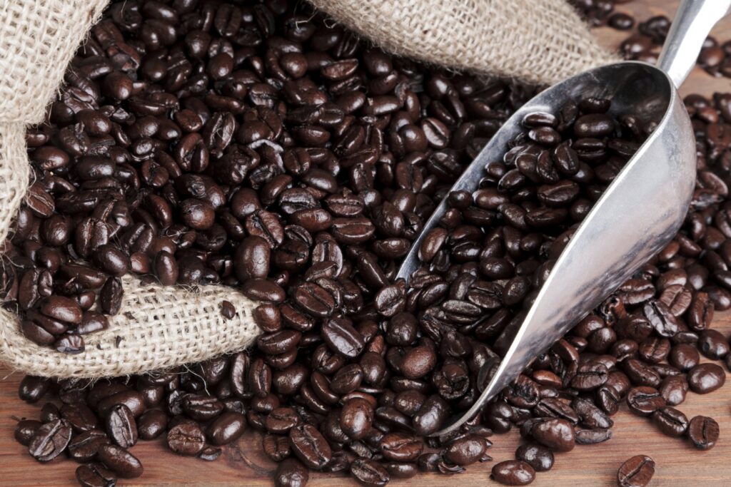 Oily, deep-brown espresso beans with smoky aroma